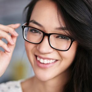 Young woman wearing a new pair of prescription glasses