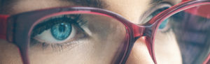 Close up of young woman wearing prescription glasses