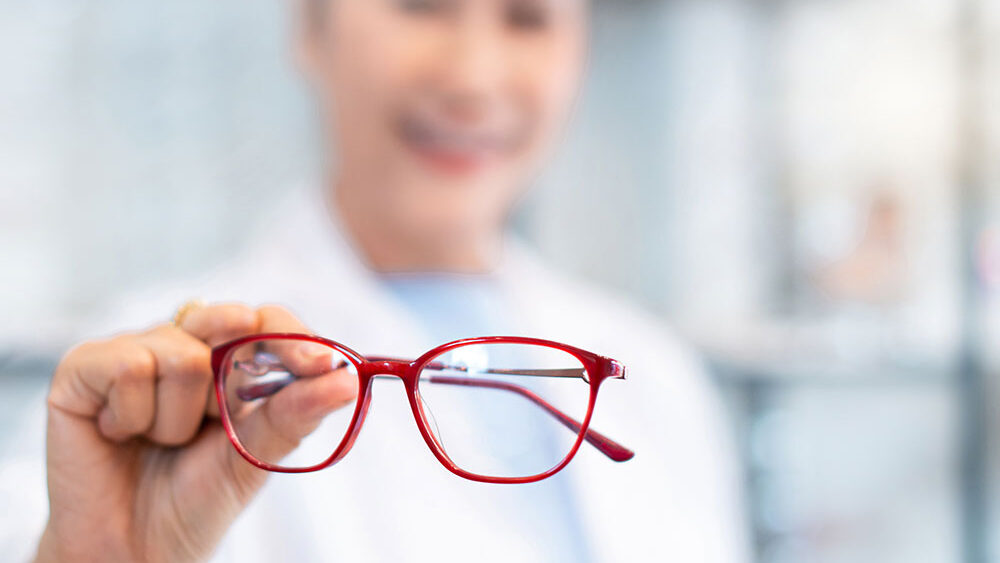 A woman showcasing glasses from Optics Suppliers Pennsylvaniax