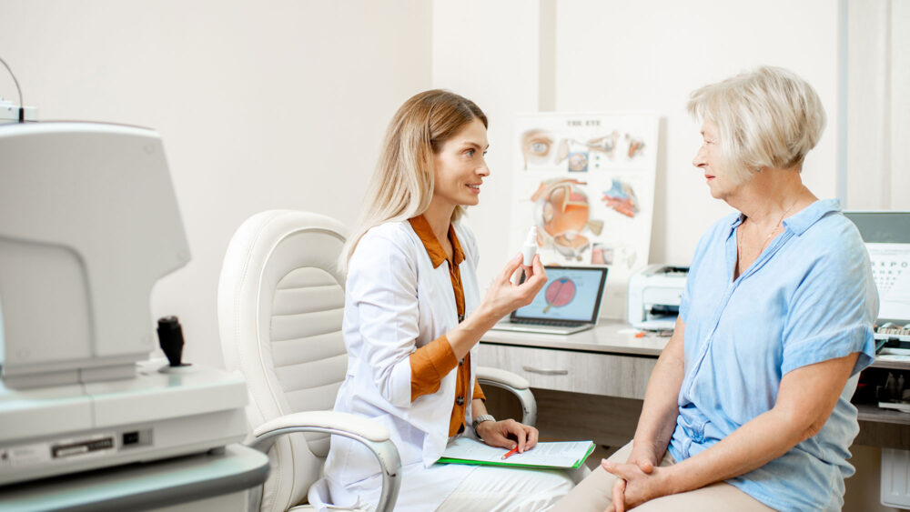 A woman discussing with a doctor in a room. Optics Suppliers Pennsylvania.