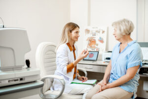 A woman discussing with a doctor in a room. Optics Suppliers Pennsylvania.