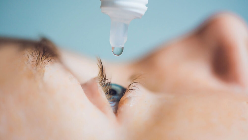 A woman's eye being treated with an eye drop. Get quality eye care products from Optics Suppliers Pennsylvania.