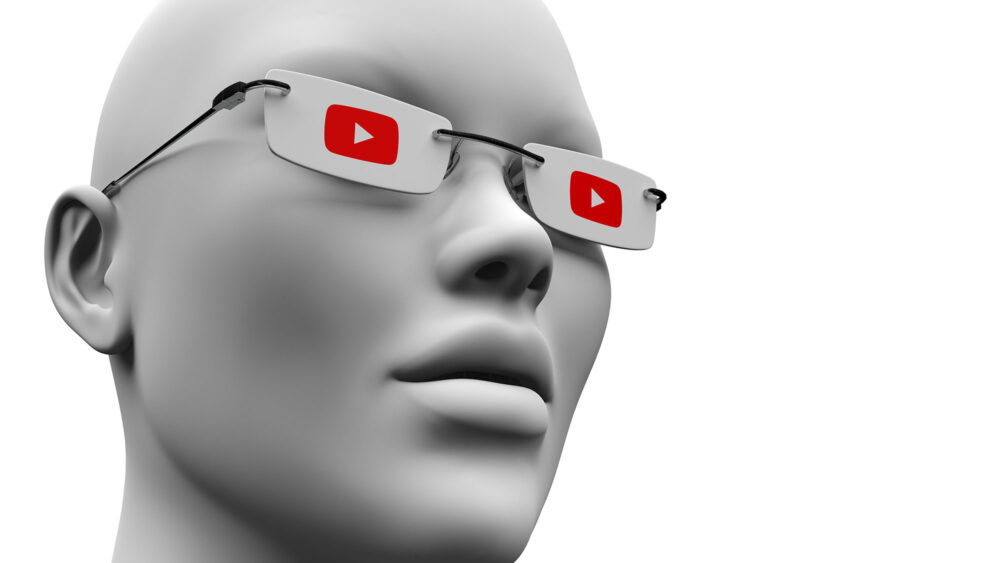 A mannequin wearing glasses and a YouTube logo, representing Optics Suppliers Pennsylvania.