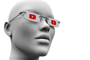 A mannequin wearing glasses and a YouTube logo, representing Optics Suppliers Pennsylvania.